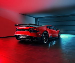 Red car inside garage with red lights