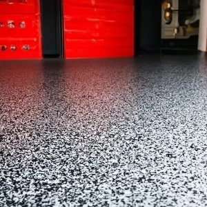 Black and white epoxy floor in garage